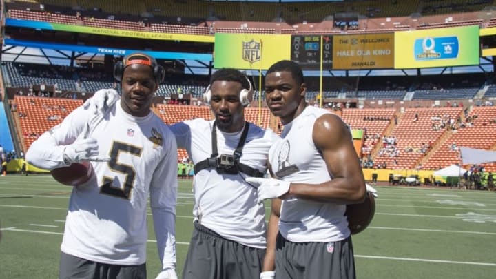 January 31, 2016; Honolulu, HI, USA; Team Irvin quarterback Teddy Bridgewater of the Minnesota Vikings (5), Team Rice wide receiver Jarvis Landry of the Miami Dolphins (14, center), and Team Rice wide receiver Amari Cooper of the Oakland Raiders (89, right) before the 2016 Pro Bowl game at Aloha Stadium. Mandatory Credit: Kyle Terada-USA TODAY Sports