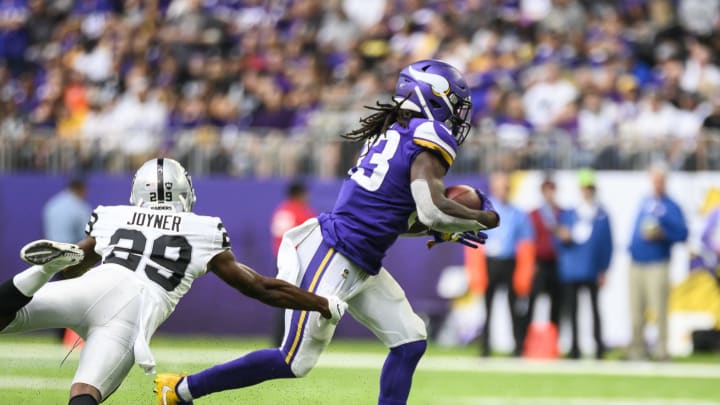 MINNEAPOLIS, MN - SEPTEMBER 22: Dalvin Cook #33 of the Minnesota Vikings runs with the ball as defender Lamarcus Joyner #29 of the Oakland Raiders attempts to tackle him in the third quarter of the game at U.S. Bank Stadium on September 22, 2019 in Minneapolis, Minnesota. (Photo by Stephen Maturen/Getty Images)