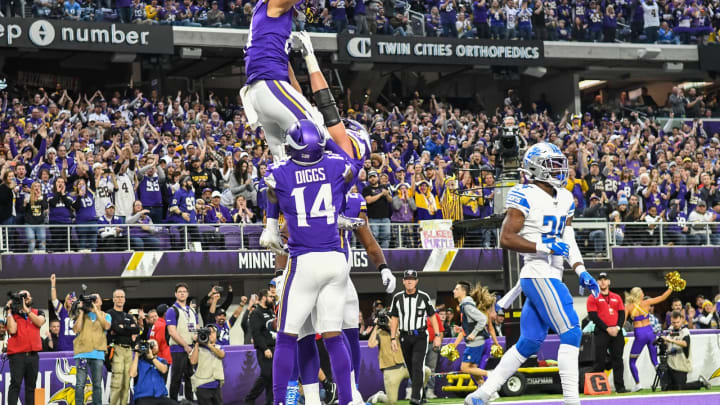 MINNEAPOLIS, MN - DECEMBER 08: Minnesota Vikings Wide Receiver Bisi Johnson (81) is thrown in the air by Minnesota Vikings Offensive Tackle Brian O'Neill (75) as Minnesota Vikings Wide Receiver Stefon Diggs (14) looks on after his 1st quarter touchdown reception during a game between the Detroit Lions and Minnesota Vikings on December 8, 2019 at U.S. Bank Stadium in Minneapolis, MN.(Photo by Nick Wosika/Icon Sportswire via Getty Images)
