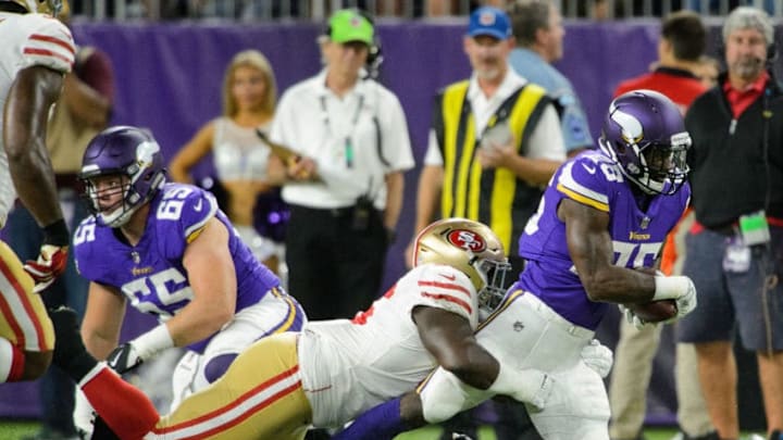 MINNEAPOLIS, MN - AUGUST 27: D.J. Jones #96 of the San Francisco 49ers tackles Latavius Murray #25 of the Minnesota Vikings in the preseason game on August 27, 2017 at U.S. Bank Stadium in Minneapolis, Minnesota. The Vikings defeated the 49ers 32-31. (Photo by Hannah Foslien/Getty Images)