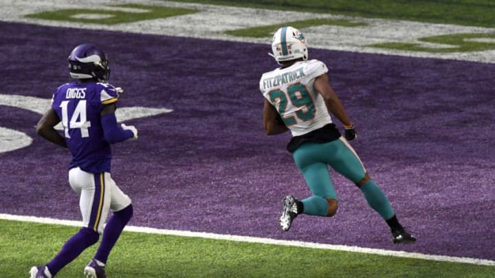MINNEAPOLIS, MN - DECEMBER 16: Minkah Fitzpatrick #29 of the Miami Dolphins runs with the ball after intercepting a pass by Kirk Cousins #8 of the Minnesota Vikings in the second quarter of the game at U.S. Bank Stadium on December 16, 2018 in Minneapolis, Minnesota. Fitzpatrick scored a 50 yard touchdown on the play. (Photo by Hannah Foslien/Getty Images)