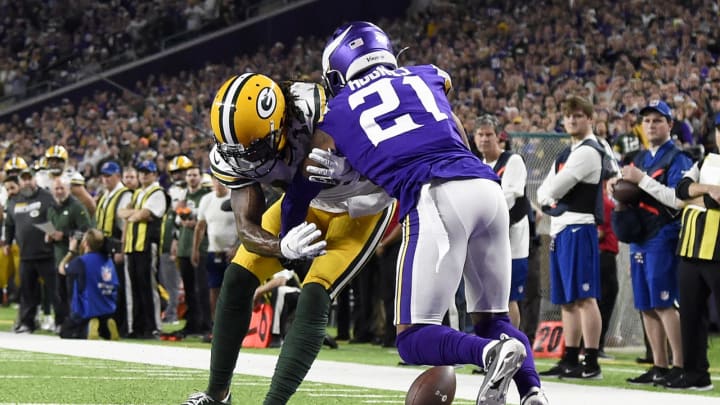 Cornerback Mike Hughes #21 of the Minnesota Vikings breaks up a pass to wide receiver Davante Adams #17 of the Green Bay Packers (Photo by Hannah Foslien/Getty Images)