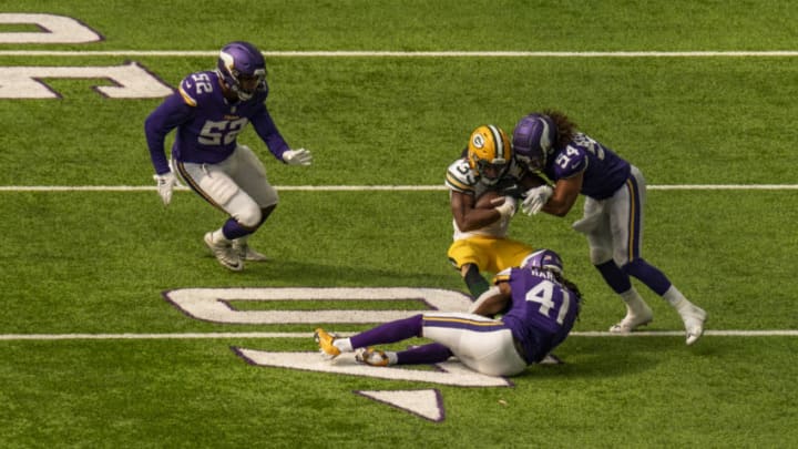 MINNEAPOLIS, MN - SEPTEMBER 13: Aaron Jones #33 of the Green Bay Packers is tackled with the ball in the fourth quarter of the game against the Minnesota Vikings at U.S. Bank Stadium on September 13, 2020 in Minneapolis, Minnesota. (Photo by Stephen Maturen/Getty Images)