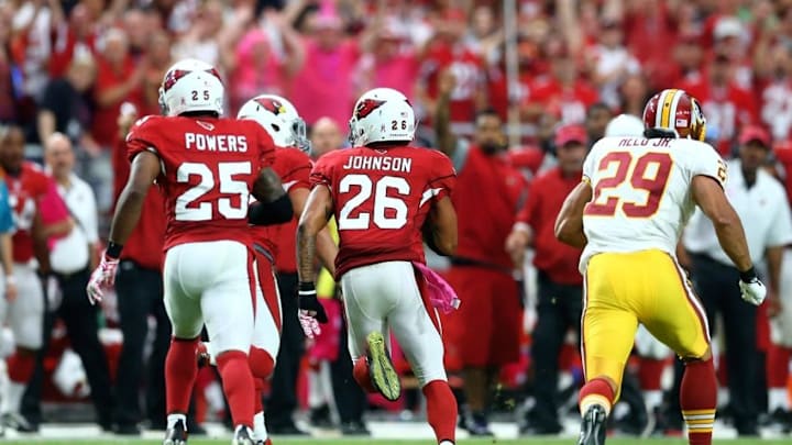 Oct 12, 2014; Glendale, AZ, USA; Arizona Cardinals safety Rashad Johnson (26) returns an interception in the fourth quarter against the Washington Redskins at University of Phoenix Stadium. The Cardinals defeated the Redskins 30-20. Mandatory Credit: Mark J. Rebilas-USA TODAY Sports