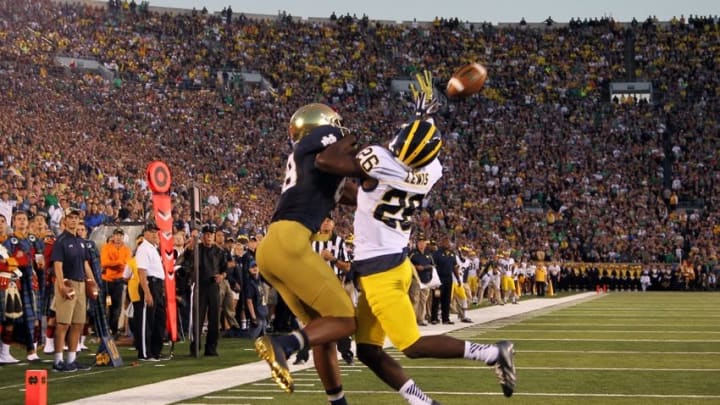 Sep 6, 2014; South Bend, IN, USA; Notre Dame Fighting Irish wide receiver Corey Robinson (88) jumps up to catch a pass in the end zone as pass interference is called against Michigan Wolverines defensive back Jourdan Lewis (26) at Notre Dame Stadium. Mandatory Credit: Brian Spurlock-USA TODAY Sports