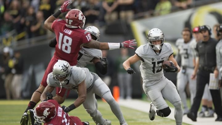 Oct 10, 2015; Eugene, OR, USA; University of Oregon Ducks wide receiver Devon Allen (13) picks up a first down during the first quarter in a game against the Washington State University Cougars at Autzen Stadium. Mandatory Credit: Troy Wayrynen-USA TODAY Sports