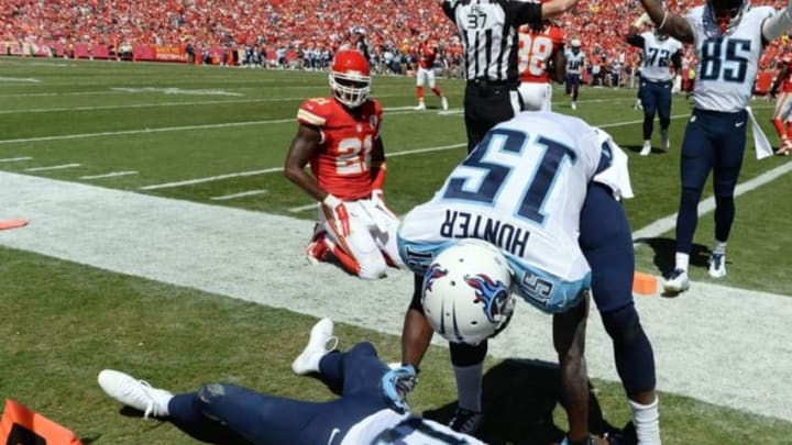 Sep 7, 2014; Kansas City, MO, USA; Tennessee Titans wide receiver Kendall Wright (13) is congratulated by wide receiver Justin Hunter (15) after scoring a touchdown against Kansas City Chiefs in the second half at Arrowhead Stadium. Tennessee won the game 26-10. Mandatory Credit: John Rieger-USA TODAY Sports