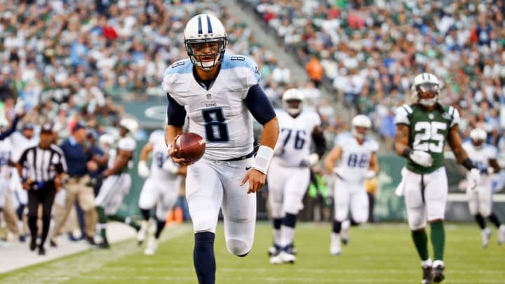 Dec 13, 2015; East Rutherford, NJ, USA; Tennessee Titans quarterback Marcus Mariota (8) catches a touchdown pass against the New York Jets at MetLife Stadium. Mandatory Credit: Vincent Carchietta-USA TODAY Sports