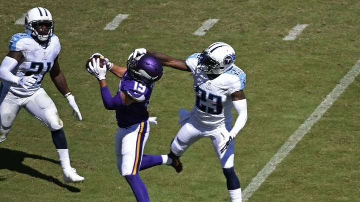 Sep 11, 2016; Nashville, TN, USA; Minnesota Vikings wide receiver Adam Thielen (19) catches the ball as Tennessee Titans defensive back Brice McCain (23) defends at Nissan Stadium. Mandatory Credit: Andrew Nelles/The Tennessean-USA TODAY Sports