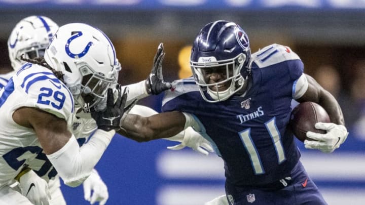 INDIANAPOLIS, IN - DECEMBER 01: A.J. Brown #11 of the Tennessee Titans stiff arms Malik Hooker #29 of the Indianapolis Colts after making a catch in the third quarter of the game against the Indianapolis Colts at Lucas Oil Stadium on December 1, 2019 in Indianapolis, Indiana. (Photo by Bobby Ellis/Getty Images)