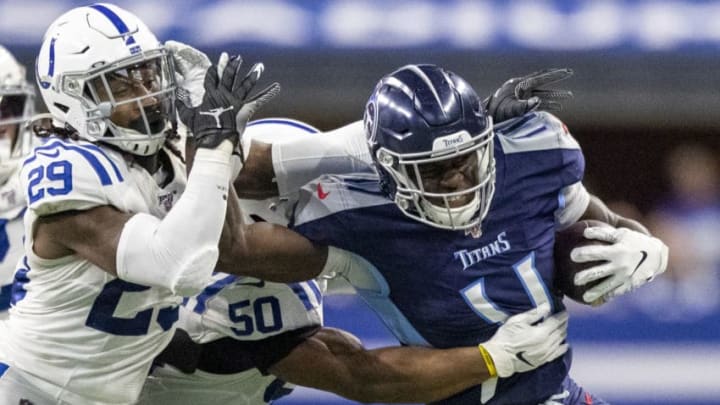 INDIANAPOLIS, IN - DECEMBER 01: A.J. Brown #11 of the Tennessee Titans stiff arms Malik Hooker #29 of the Indianapolis Colts after making a catch in the third quarter of the game against the Indianapolis Colts at Lucas Oil Stadium on December 1, 2019 in Indianapolis, Indiana. (Photo by Bobby Ellis/Getty Images)