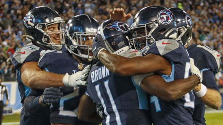 NASHVILLE, TENNESSEE - NOVEMBER 24: A.J. Brown #11 of the Tennessee Titans is congratulated by teammates after scoring a touchdown against the Jacksonville Jaguars during the second half at Nissan Stadium on November 24, 2019 in Nashville, Tennessee. (Photo by Frederick Breedon/Getty Images)