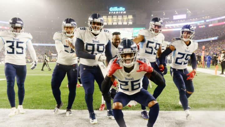 FOXBOROUGH, MASSACHUSETTS - JANUARY 04: Logan Ryan #26 of the Tennessee Titans celebrates his touchdown with teammates in the fourth quarter of the AFC Wild Card Playoff game against the New England Patriots at Gillette Stadium on January 04, 2020 in Foxborough, Massachusetts. (Photo by Kathryn Riley/Getty Images)