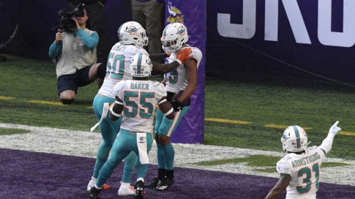 MINNEAPOLIS, MN - DECEMBER 16: Minkah Fitzpatrick #29 of the Miami Dolphins celebrates scoring a touchdown after intercepting a pass by Kirk Cousins #8 of the Minnesota Vikings in the second quarter of the game at U.S. Bank Stadium on December 16, 2018 in Minneapolis, Minnesota. (Photo by Hannah Foslien/Getty Images)