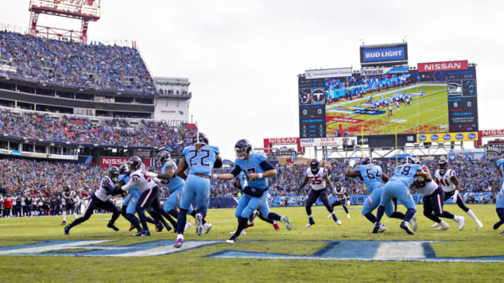 NASHVILLE, TN - DECEMBER 15: Ryan Tannehill #17 hands off the ball to Derrick Henry #22 of the Tennessee Titans during a game against the Houston Texans at Nissan Stadium on December 15, 2019 in Nashville, Tennessee. The Texans defeated the Titans 24-21. (Photo by Wesley Hitt/Getty Images)