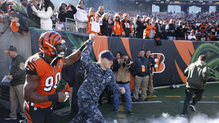 CINCINNATI, OH – NOVEMBER 26: Michael Johnson #90 of the Cincinnati Bengals takes the field along with a member of the military prior to a game against the Cleveland Browns at Paul Brown Stadium on November 26, 2017 in Cincinnati, Ohio. The Bengals won 30-16. (Photo by Joe Robbins/Getty Images)