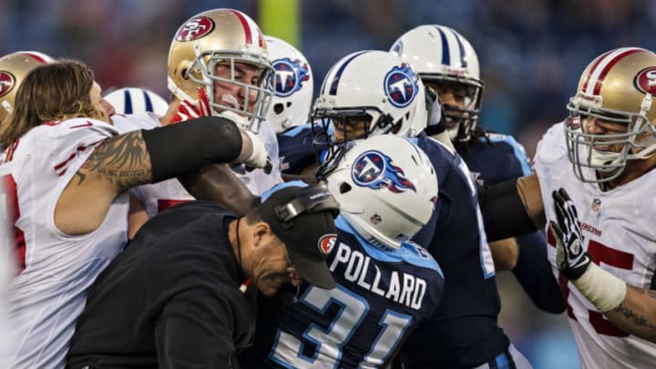 NASHVILLE, TN - OCTOBER 20: Head Coach Jim Harbaugh of the San Francisco 49ers is in the middle of a fight with Bernard Pollard