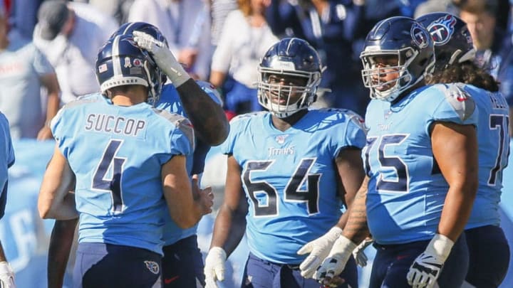 NASHVILLE, TENNESSEE - NOVEMBER 10: Kicker Ryan Succop #4 of the Tennessee Titans is consoled by teammates after missing an extra point during the first half of a game against the Kansas City Chiefs at Nissan Stadium on November 10, 2019 in Nashville, Tennessee. (Photo by Frederick Breedon/Getty Images)