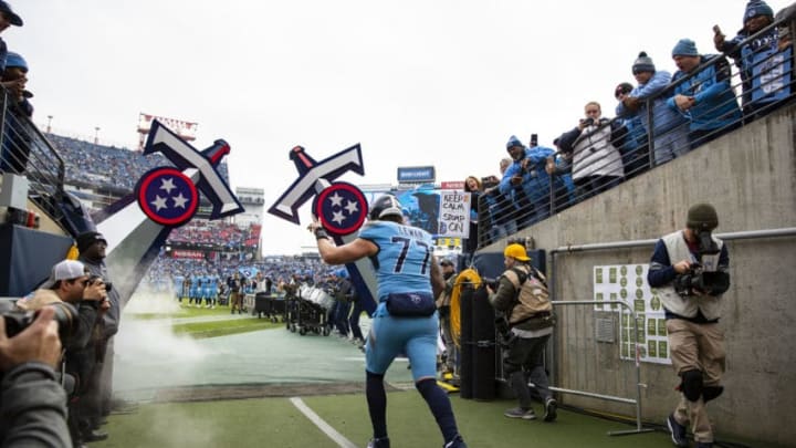 NASHVILLE, TN - DECEMBER 15: Taylor Lewan #77 of the Tennessee Titans enters the field as he exits the tunnel before the game against the Houston Texans at Nissan Stadium on December 15, 2019 in Nashville, Tennessee. Houston defeats Tennessee 24-21. (Photo by Brett Carlsen/Getty Images)