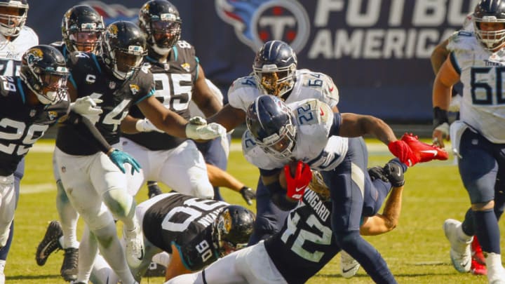 NASHVILLE, TENNESSEE - SEPTEMBER 20: Andrew Wingard #42 of the Jacksonville Jaguars tackles Derrick Henry #22 of the Tennessee Titans at Nissan Stadium on September 20, 2020 in Nashville, Tennessee. (Photo by Frederick Breedon/Getty Images)