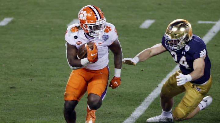 CHARLOTTE, NORTH CAROLINA – DECEMBER 19: Running back Travis Etienne #9 of the Clemson Tigers runs with the ball on a kickoff return in the second half against the Notre Dame Fighting Irish during the ACC Championship game at Bank of America Stadium on December 19, 2020 in Charlotte, North Carolina. (Photo by Jared C. Tilton/Getty Images)