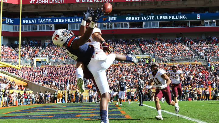 Jan 1, 2020; Tampa, Florida, USA;Minnesota Golden Gophers defensive back Benjamin St-Juste (25) breaks up Auburn Tigers wide receiver Seth Williams (18) during the first quarter at Raymond James Stadium. Mandatory Credit: Kim Klement-USA TODAY Sports