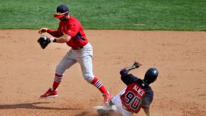 Mar 11, 2015; Lake Buena Vista, FL, USA; St. Louis Cardinals second baseman Greg Garcia (35) steps on second for the force out on Atlanta Braves Ozhaino Albies (90) during a spring training baseball game at Champion Stadium. The St. Louis Cardinals beat the Atlanta Braves 6-2. Mandatory Credit: Reinhold Matay-USA TODAY Sports