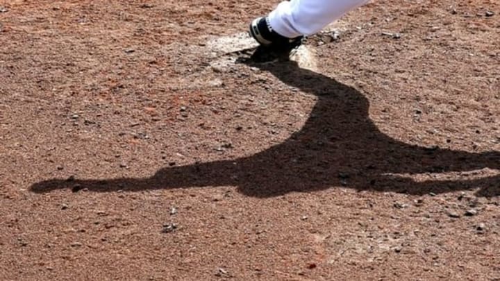 Mar 16, 2016; Lake Buena Vista, FL, USA; The shadow of Atlanta Braves relief pitcher Kyle Kinman on the mound as he pitches against the St. Louis Cardinals during the seventh inning at Champion Stadium. Mandatory Credit: Butch Dill-USA TODAY Sports