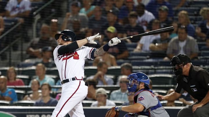 Jun 24, 2016; Atlanta, GA, USA; Atlanta Braves third baseman Brandon Snyder (19) hits a three-run home run as New York Mets catcher Travis d Jun 24, 2016; Atlanta, GA, USA; Atlanta Braves third baseman Brandon Snyder (19) hits a three-run home run as New York Mets catcher Travis d