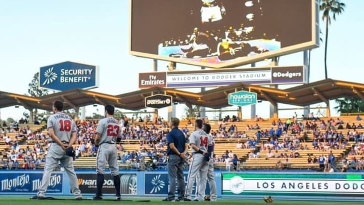 Jun 4, 2016; Los Angeles, CA, USA; Atlanta Braves players observe a moment of silence during a pre-game ceremony honoring Muhammad Ali before their game against the Los Angeles Dodgers at Dodger Stadium. Ali passed away Friday 6-3-2016. Mandatory Credit: Robert Hanashiro-USA TODAY Sports
