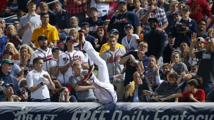 Sep 30, 2016; Atlanta, GA, USA; Atlanta Braves first baseman Freddie Freeman (5) dives for a foul ball in the crowd against the Detroit Tigers in the fifth inning at Turner Field. Mandatory Credit: Brett Davis-USA TODAY Sports