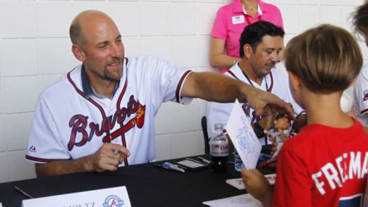 Jul 29, 2016; Atlanta, GA, USA; Atlanta Braves former pitcher John Smol tz (29) signs autographs before a game against the Philadelphia Phillies at Turner Field. Mandatory Credit: Brett Davis-USA TODAY Sports