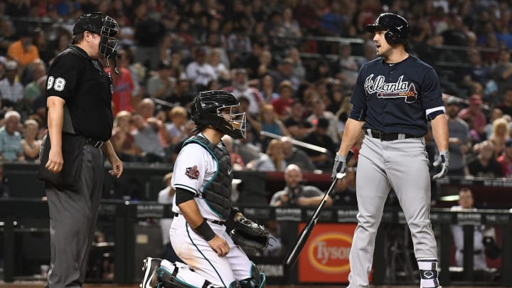 PHOENIX, AZ – SEPTEMBER 07: Adam Duvall #23 of the Atlanta Braves reacts to a called third strike made by umpire Doug Eddings #88 during the eighth inning of the MLB game against the Arizona Diamondbacks at Chase Field on September 7, 2018 in Phoenix, Arizona. (Photo by Jennifer Stewart/Getty Images)