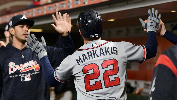SAN FRANCISCO, CA – SEPTEMBER 11: Nick Markakis #22 of the Atlanta Braves is congratulated by teammates after he scored against the San Francisco Giants in the top of the fourth inning at AT&T Park on September 11, 2018 in San Francisco, California. (Photo by Thearon W. Henderson/Getty Images)