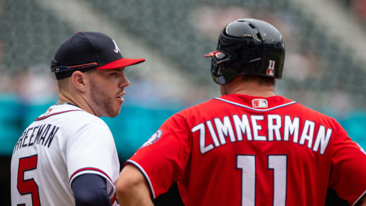 ATLANTA, GA - SEPTEMBER 16: Freddie Freeman #5 of the Atlanta Braves chats with Ryan Zimmerman of the Washington Nationals at first base at SunTrust Park on September 16, 2018 in Atlanta, Georgia.(Photo by Kelly Kline/Getty Images)