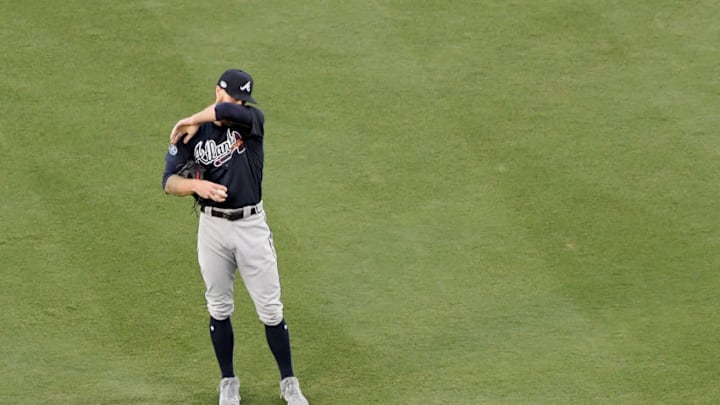 LOS ANGELES, CA - OCTOBER 04: Mike Foltynewicz #26 of the Atlanta Braves reacts after allowing a walk against the Los Angeles Dodgers during Game One of the National League Division Series at Dodger Stadium on October 4, 2018 in Los Angeles, California. (Photo by Harry How/Getty Images)