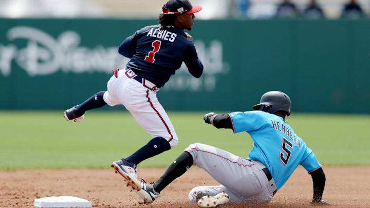 LAKE BUENA VISTA, FLORIDA - MARCH 03: Ozzie Albies #1 of the Atlanta Braves turns a double play past Rosell Herrera #5 of the Miami Marlins in the first inning during the Grapefruit League spring training game at Champion Stadium on March 03, 2019 in Lake Buena Vista, Florida. (Photo by Dylan Buell/Getty Images) LAKE BUENA VISTA, FLORIDA - MARCH 03: Ozzie Albies #1 of the Atlanta Braves turns a double play past Rosell Herrera #5 of the Miami Marlins in the first inning during the Grapefruit League spring training game at Champion Stadium on March 03, 2019 in Lake Buena Vista, Florida. (Photo by Dylan Buell/Getty Images)