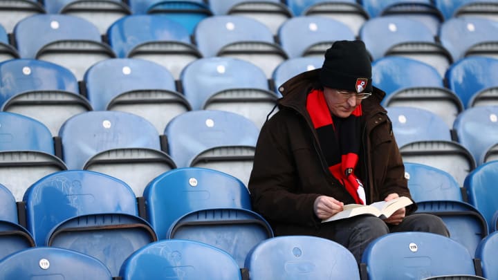 HUDDERSFIELD, ENGLAND – MARCH 09: A fan reads a book inprior to the Premier League match between Huddersfield Town and AFC Bournemouth at John Smith’s Stadium on March 09, 2019 in Huddersfield, United Kingdom. (Photo by Matthew Lewis/Getty Images)