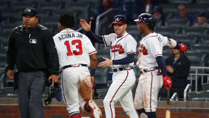 ATLANTA, GA - APRIL 4: Freddie Freeman #5 of the Atlanta Braves celebrates with Ronald Acuna Jr. #13 and Ozzie Albies #1 as three runs are brought in during the fifth inning of an MLB game against the Chicago Cubs at SunTrust Park on April 4, 2018 in Atlanta, Georgia. (Photo by Todd Kirkland/Getty Images)