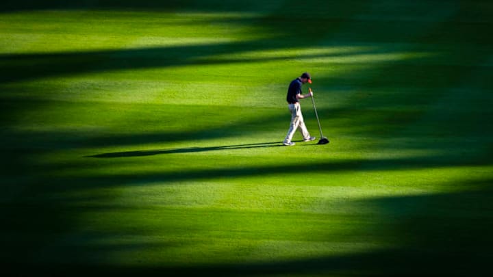 ATLANTA, GA - APRIL 13: A grounds crewman prepares the field for an Atlanta Braves and New York Mets baseball game at SunTrust Park on April 13, 2019 in Atlanta, Georgia. (Photo by John Amis/Getty Images)