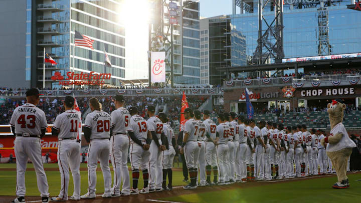 ATLANTA, GEORGIA - APRIL 01: The Atlanta Braves stand prior to the National Anthem before facing the Chicago Cubs April 01, 2019 in Atlanta, Georgia. (Photo by Kevin C. Cox/Getty Images)