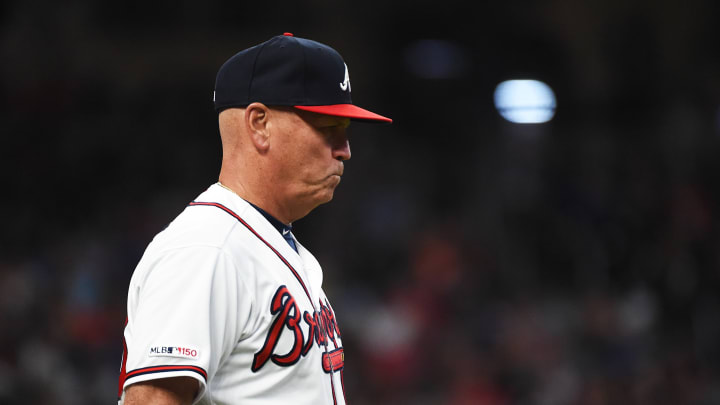 ATLANTA, GEORGIA – APRIL 06: Brian Snitker #43 of the Atlanta Braves walks to check on a player during their game against the Miami Marlins at SunTrust on April 06, 2019 in Atlanta, Georgia. (Photo by Logan Riely/Getty Images)