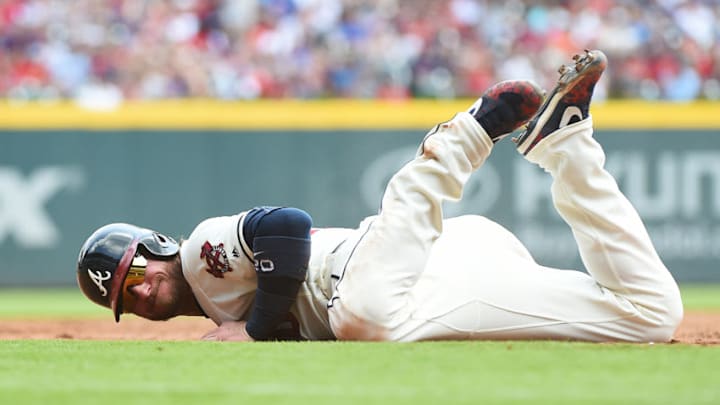 ATLANTA, GEORGIA - APRIL 28: Josh Donaldson #20 of the Atlanta Braves slides back to third base safely against the Colorado Rockies at SunTrust Park on April 28, 2019 in Atlanta, Georgia. (Photo by Logan Riely/Getty Images)