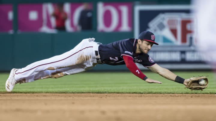 WASHINGTON, DC - JUNE 21: Trea Turner #7 of the Washington Nationals dives for a ground ball against the Atlanta Braves during the fifth inning at Nationals Park on June 21, 2019 in Washington, DC. (Photo by Scott Taetsch/Getty Images)