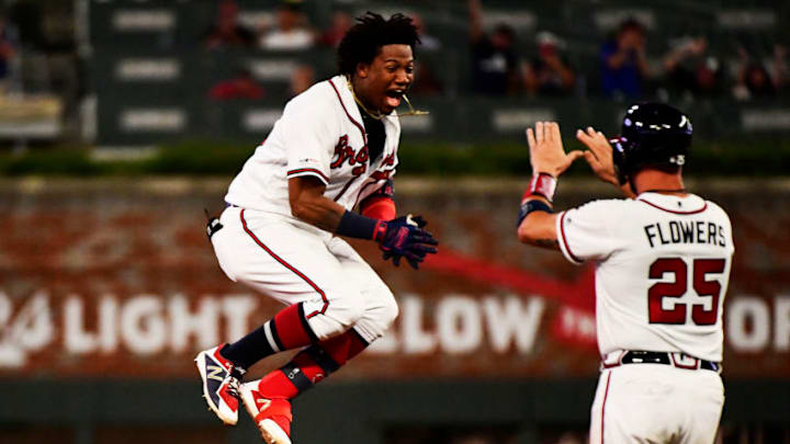 ATLANTA, GEORGIA - AUGUST 22: Ronald Acuna Jr. #13 of the Atlanta Braves hits a walk off single in the ninth inning against the Miami Marlins at SunTrust Park on August 22, 2019 in Atlanta, Georgia. (Photo by Logan Riely/Getty Images)