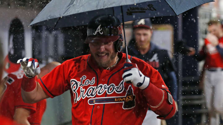 ATLANTA, GEORGIA – SEPTEMBER 06: Third baseman Josh  Donaldson #20 of the Atlanta Braves celebrates in the dugout with an umbrella after hitting a 2-run home run in the seventh inning during the game against the Washington Nationals at SunTrust Park on September 06, 2019 in Atlanta, Georgia. (Photo by Mike Zarrilli/Getty Images)