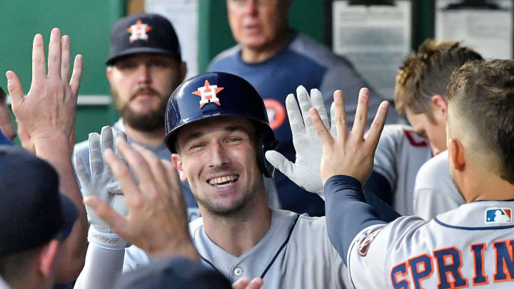 KANSAS CITY, MISSOURI – SEPTEMBER 14: Alex Bregman #2 of the Houston Astros is congratulated in the dugout after hitting a fourth inning solo home run against the Kansas City Royals at Kauffman Stadium on September 14, 2019 in Kansas City, Missouri. (Photo by John Sleezer/Getty Images)