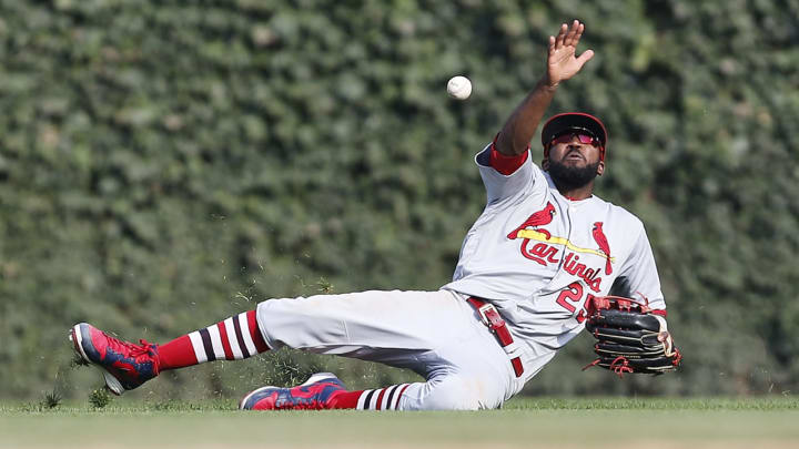 CHICAGO, ILLINOIS – SEPTEMBER 20: Dexter Fowler #25 of the St. Louis Cardinals misses the single by Nico Hoerner #2 of the Chicago Cubs during the seventh inning of a game at Wrigley Field on September 20, 2019 in Chicago, Illinois. (Photo by Nuccio DiNuzzo/Getty Images)