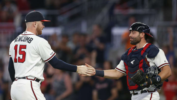 ATLANTA, GEORGIA – SEPTEMBER 21: Pitcher Sean Newcomb #15 and catcher Francisco Cervelli #45 of the Atlanta Braves shake hands after the game against the San Francisco Giants at SunTrust Park on September 21, 2019 in Atlanta, Georgia. (Photo by Mike Zarrilli/Getty Images)