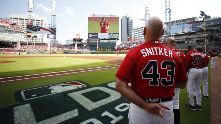 ATLANTA, GEORGIA – OCTOBER 04: Brian Snitker #43 of the Atlanta Braves stands during the national anthem prior to game two of the National League Division Series against the St. Louis Cardinals at SunTrust Park on October 04, 2019 in Atlanta, Georgia. (Photo by Todd Kirkland/Getty Images)